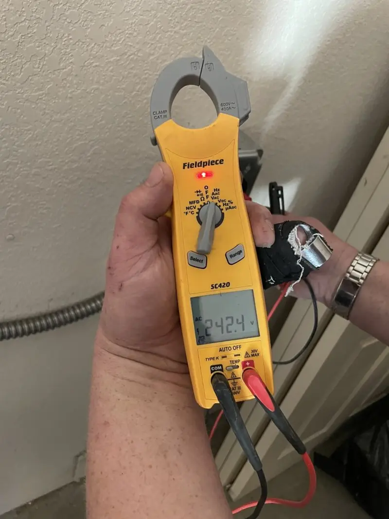 Voltage testing with clamp meter during Ceiling Fan Installation in Fairwood